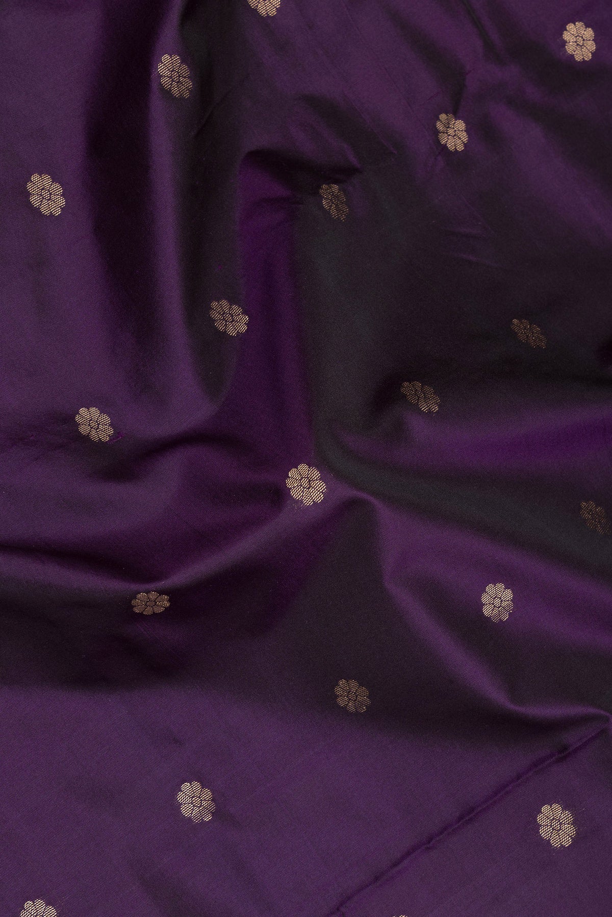 Close up of Violet Blended Paithani Silk Saree with Zari Butta on the body and Zari Border.  displaying folds