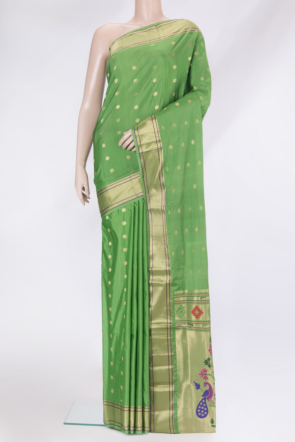 Green Paithani Silk Saree with Zari Butta on the body and Zari Border.  displayed on a mannequin