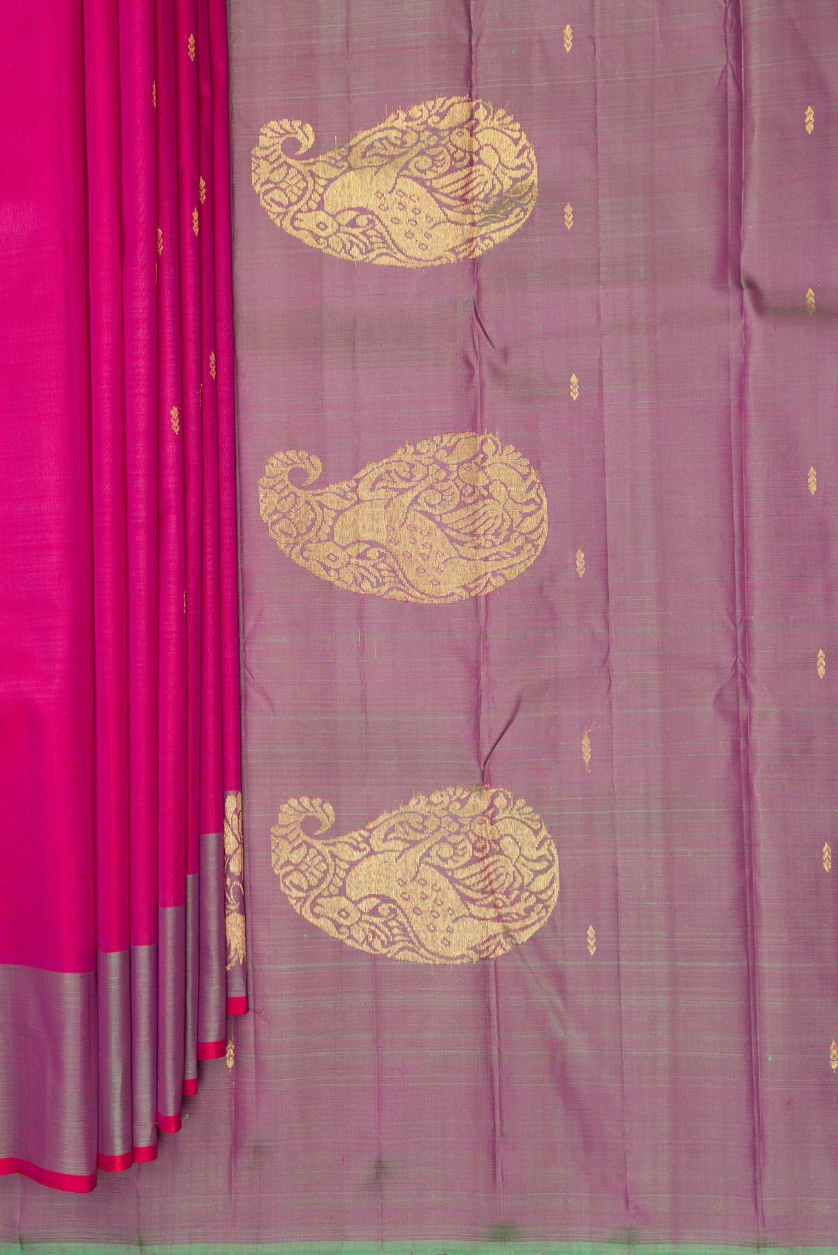 Pleats and pallu of Pure Silk Pink Kanchipuram Saree with Zari Butta on the body and Fancy Border. 