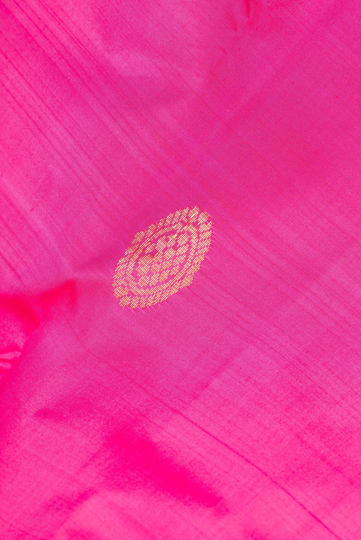 Close up of Pure Silk Pink Dual Tone Kanchipuram Saree with Zari Butta on the body and Fancy Border.  displaying folds