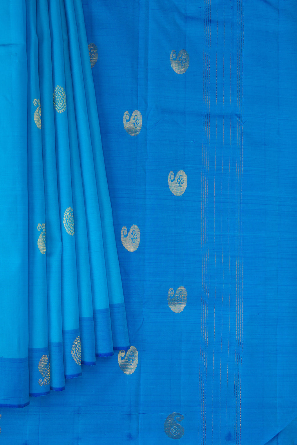 Pleats and pallu of Sky Blue Kanchipuram Silk Saree with Zari Butta on the body and Fancy Border. 
