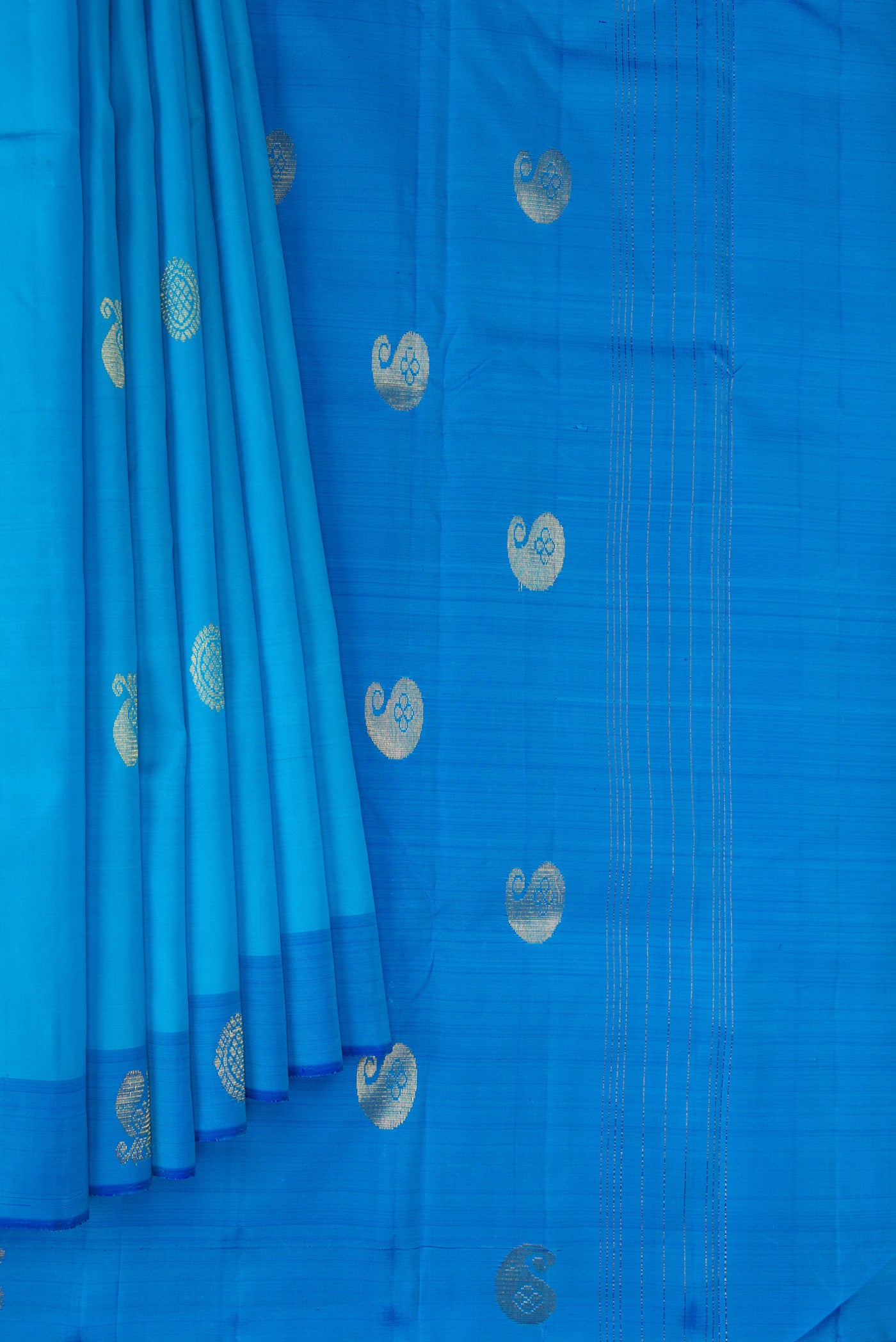 Pleats and pallu of Sky Blue Kanchipuram Silk Saree with Zari Butta on the body and Fancy Border. 