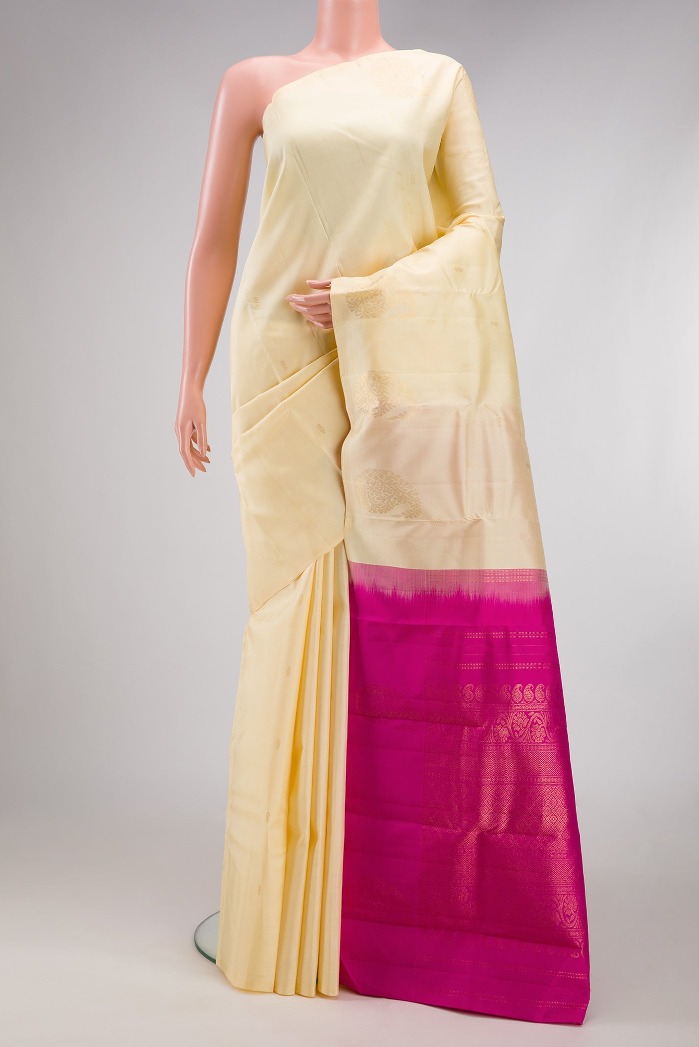 Sandal Kanchipuram Silk Saree with Zari Butta on the body and Without Border.  displayed on a mannequin