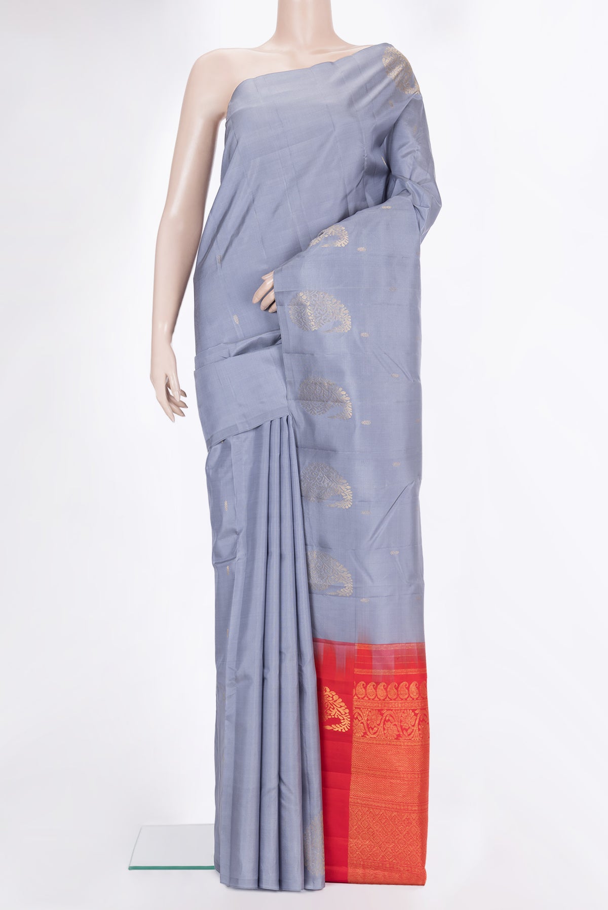 Pure Silk Grey Kanchipuram Saree with Zari Butta on the body and Without Border.  displayed on a mannequin