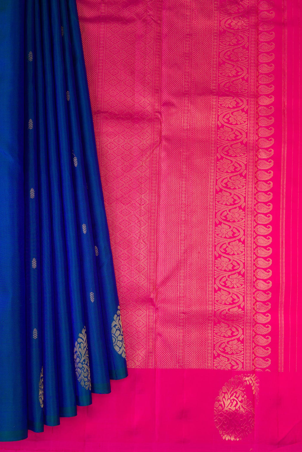 Pleats and pallu of Peacock Blue Kanchipuram Silk Saree with Zari Butta on the body and Fancy Border. 