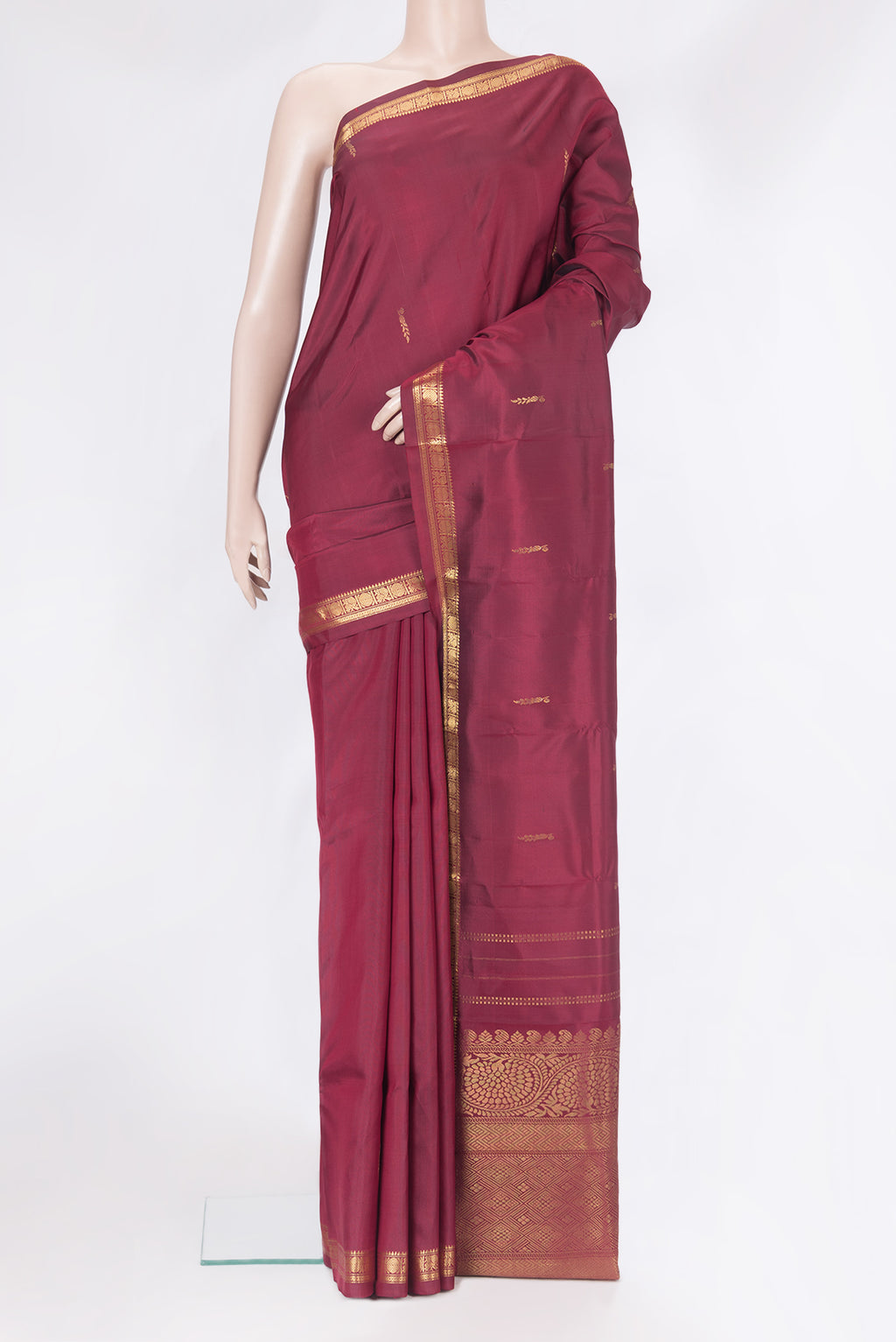 Maroon Dual Tone Blended Kanjivaram Silk Saree with Zari Butta on the body and Zari Border.  displayed on a mannequin