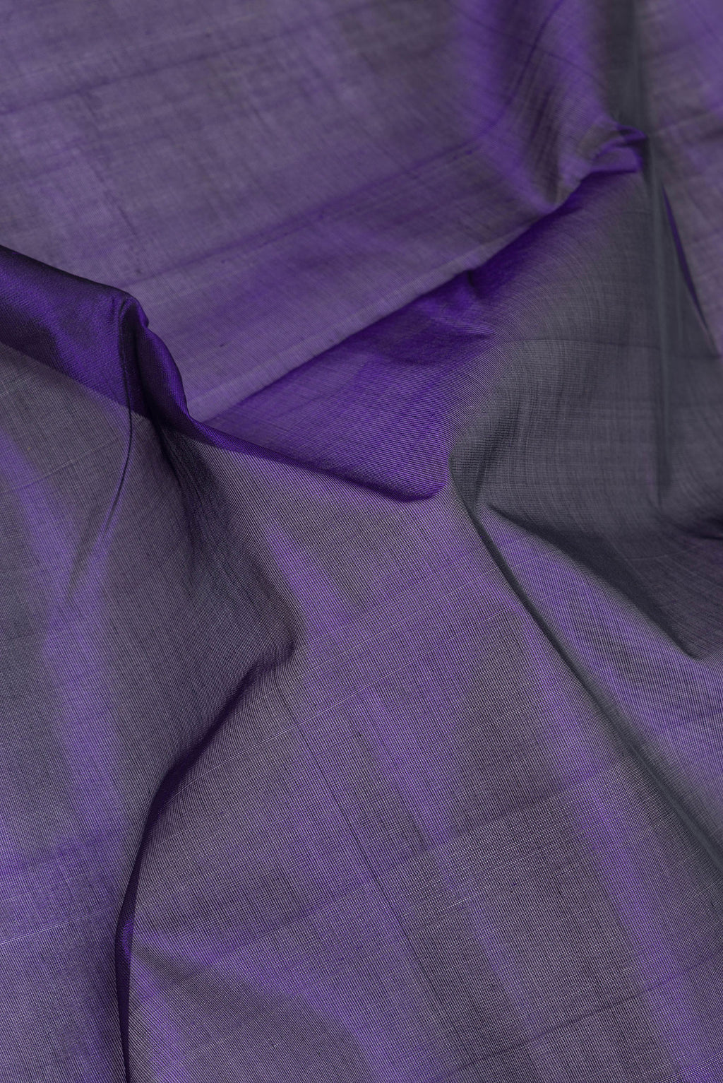 Close up of Violet Silk Cotton Saree with Plain Body and Zari Border.  displaying folds