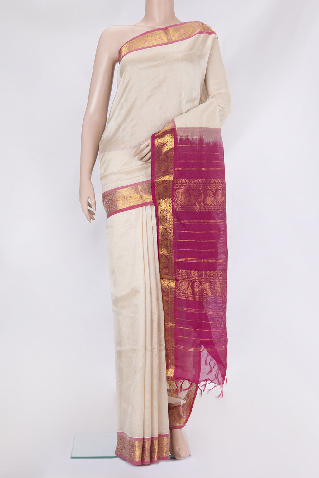 White Silk Cotton Saree with Plain Body and Zari Border.  displayed on a mannequin
