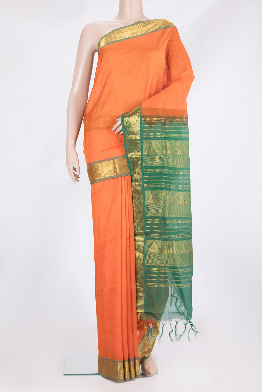 Orange Silk Cotton Saree with Plain Body and Zari Border.  displayed on a mannequin