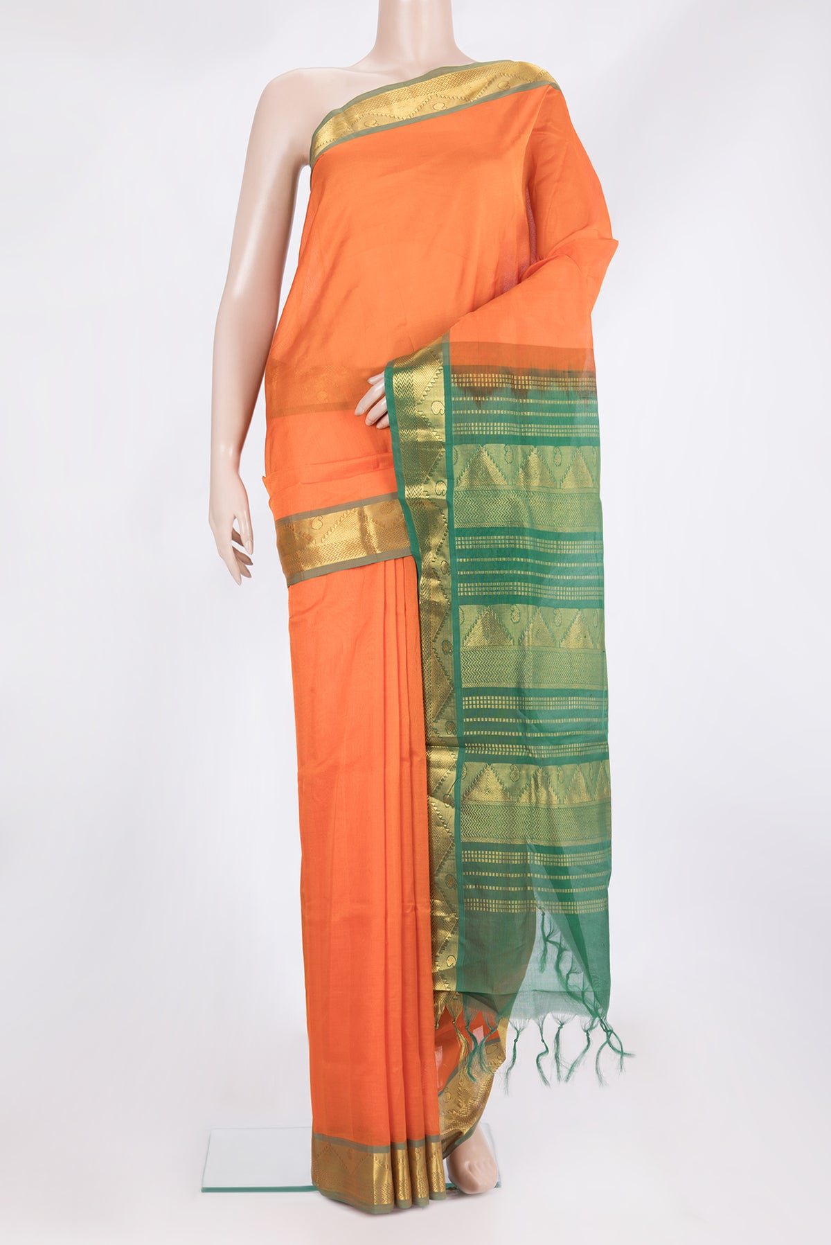Orange Silk Cotton Saree with Plain Body and Zari Border.  displayed on a mannequin