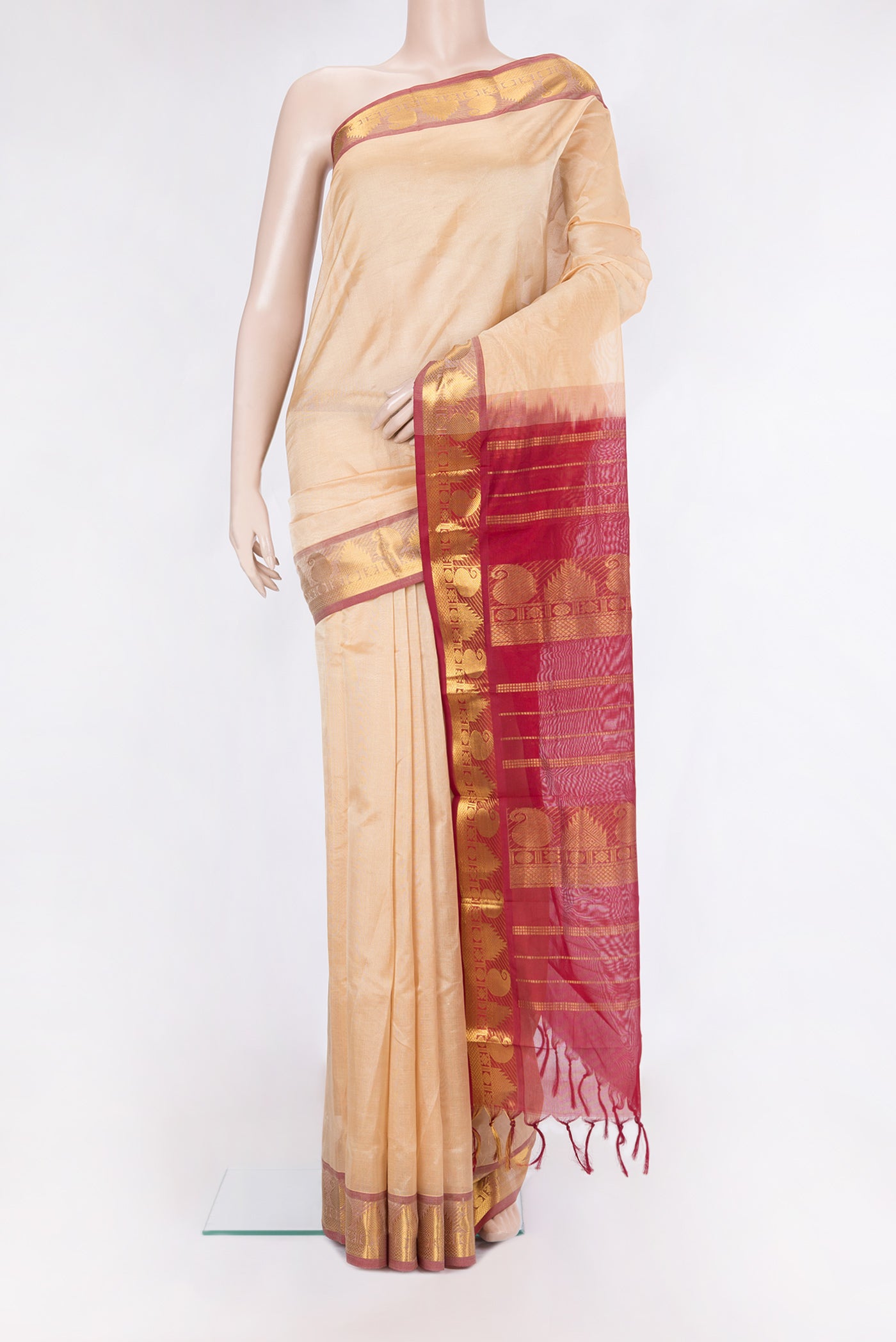 Sandal Silk Cotton Saree with Plain Body and Zari Border.  displayed on a mannequin