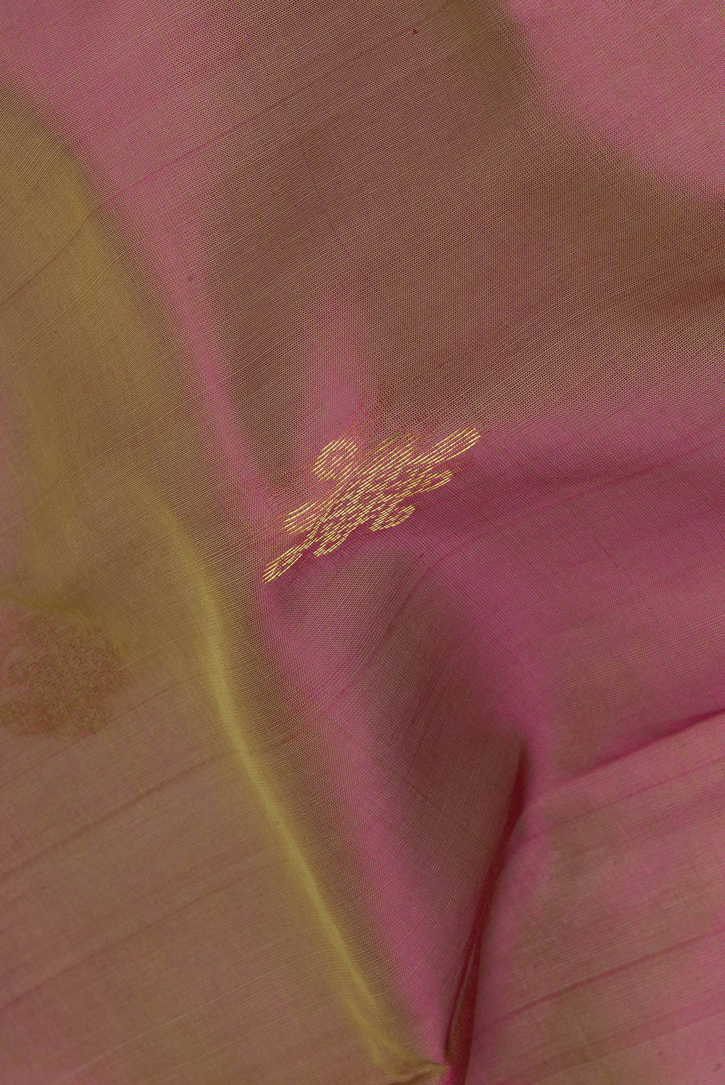 Close up of Green Silk Cotton Saree with Zari Butta on the body and Zari Border.  displaying folds