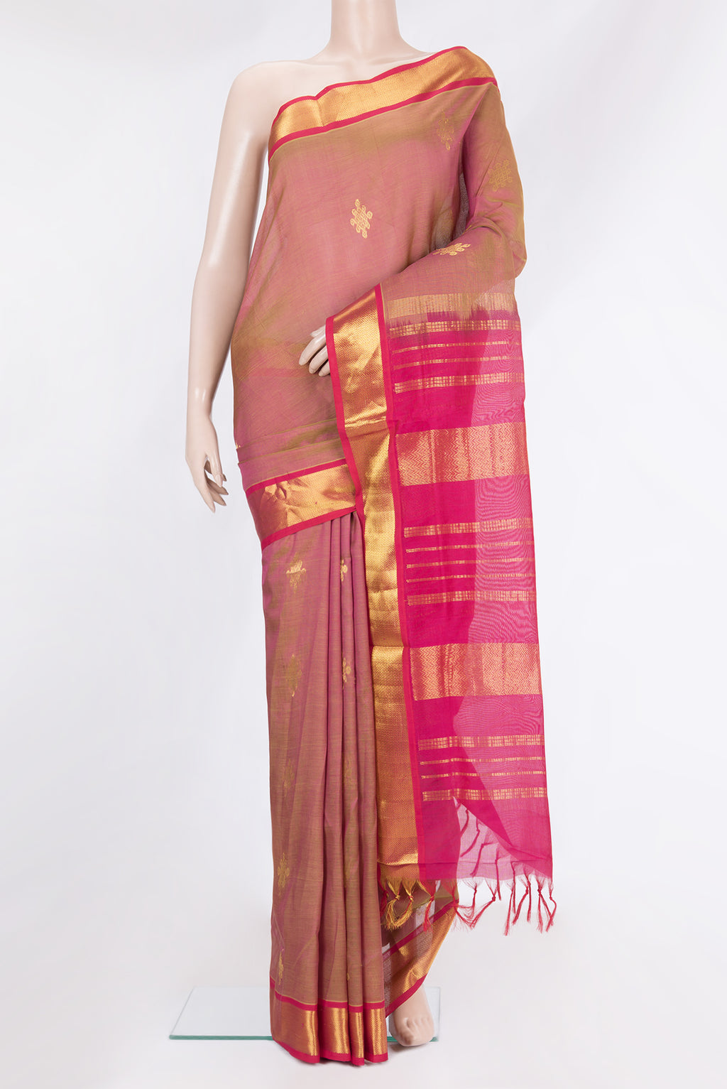 Green Silk Cotton Saree with Zari Butta on the body and Zari Border.  displayed on a mannequin