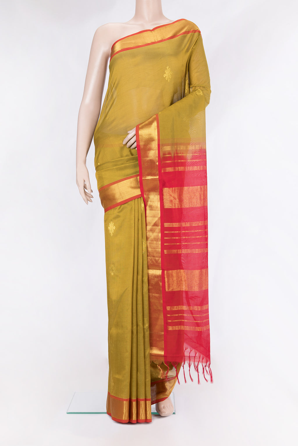 Mehandi Green Silk Cotton Saree with Zari Butta on the body and Zari Border.  displayed on a mannequin