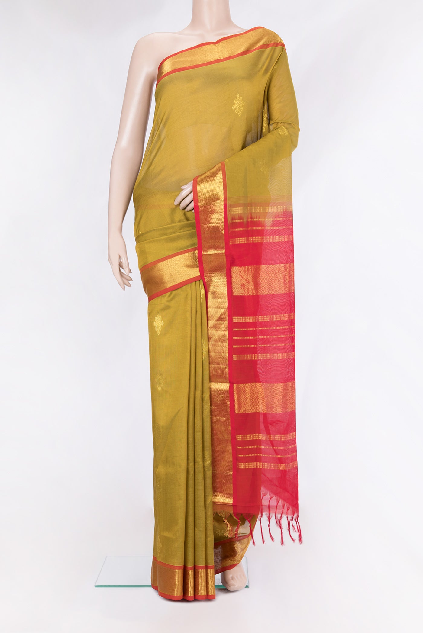 Mehandi Green Silk Cotton Saree with Zari Butta on the body and Zari Border.  displayed on a mannequin