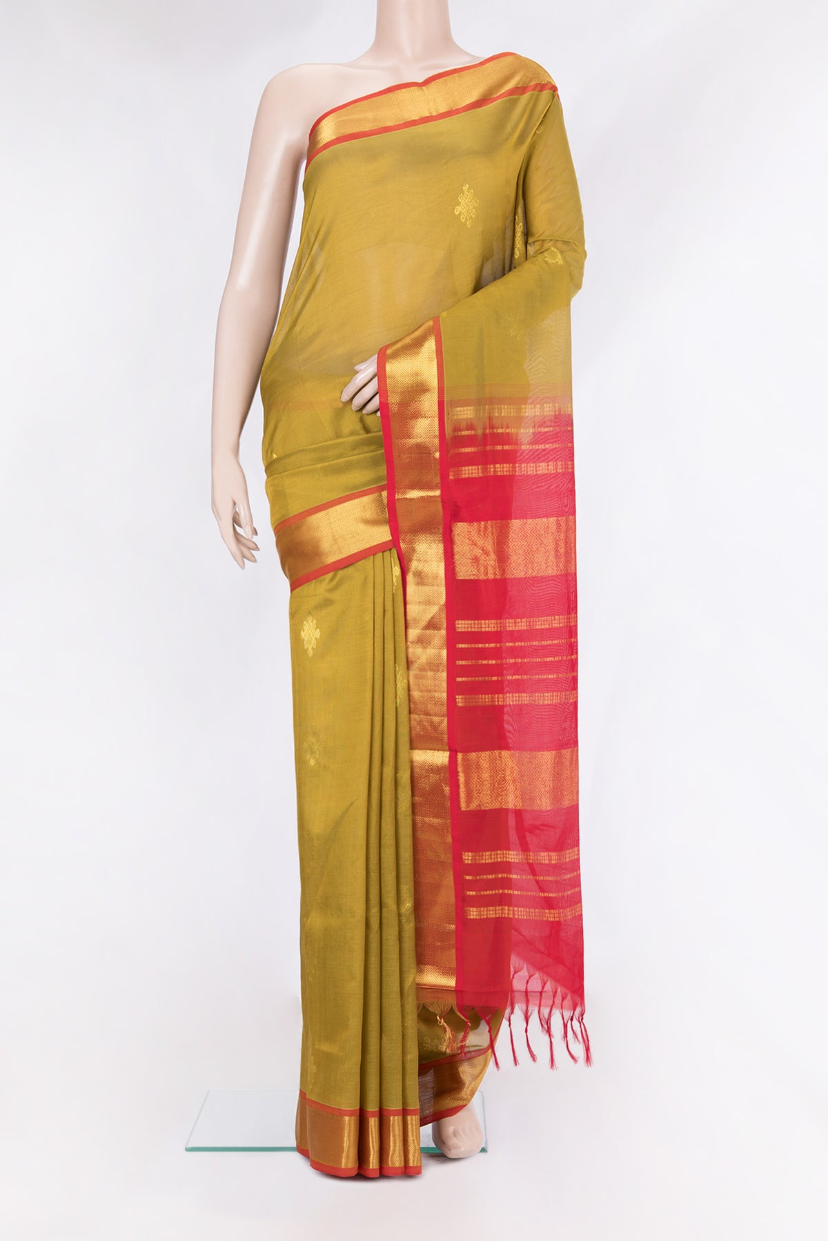 Mehandi Green Silk Cotton Saree with Zari Butta on the body and Zari Border.  displayed on a mannequin