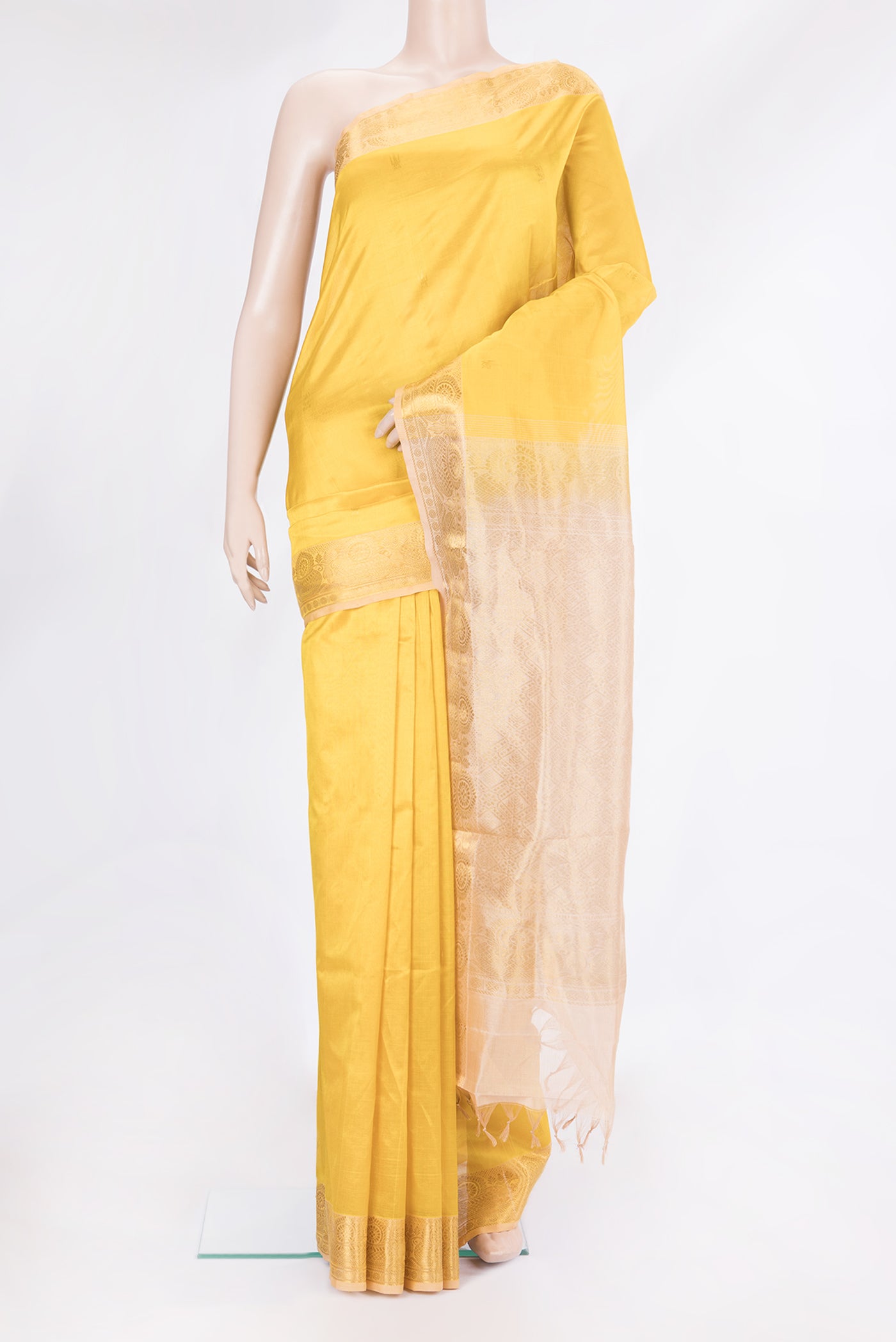 Yellow Silk Cotton Saree with Zari Butta on the body and Zari Border.  displayed on a mannequin