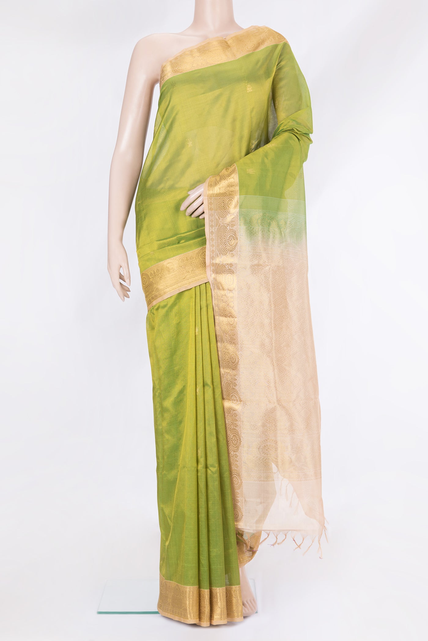 Green Silk Cotton Saree with Zari Butta on the body and Zari Border.  displayed on a mannequin