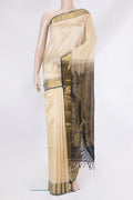 Beige Silk Cotton Saree with Zari Butta on the body and Zari Border.  displayed on a mannequin