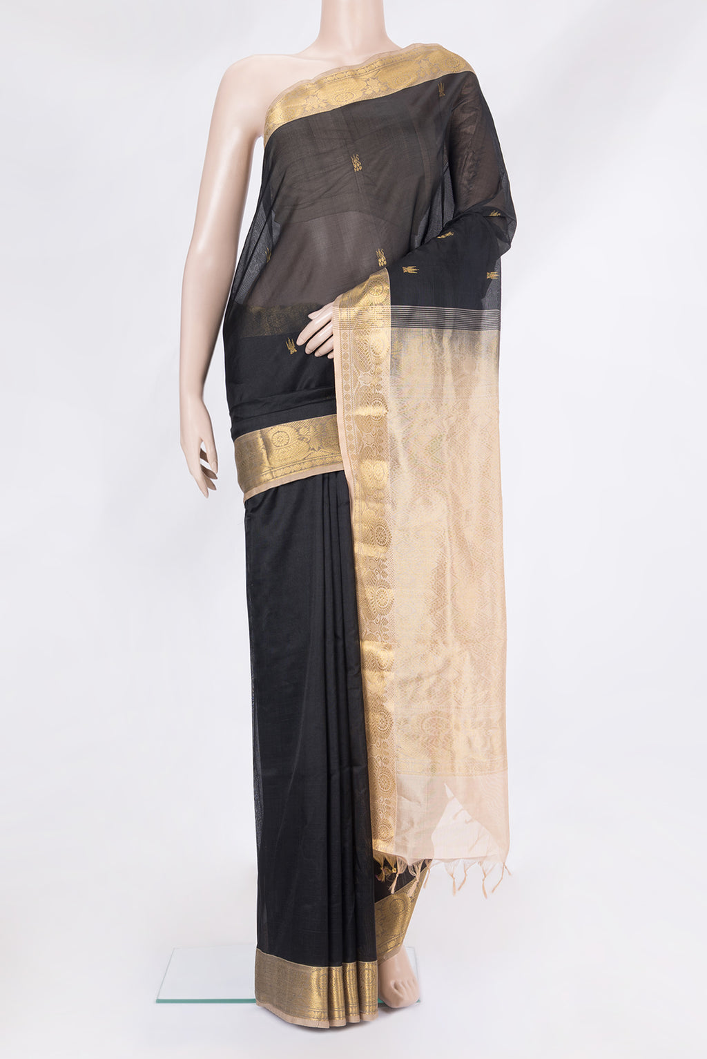 Black Silk Cotton Saree with Zari Butta on the body and Zari Border.  displayed on a mannequin