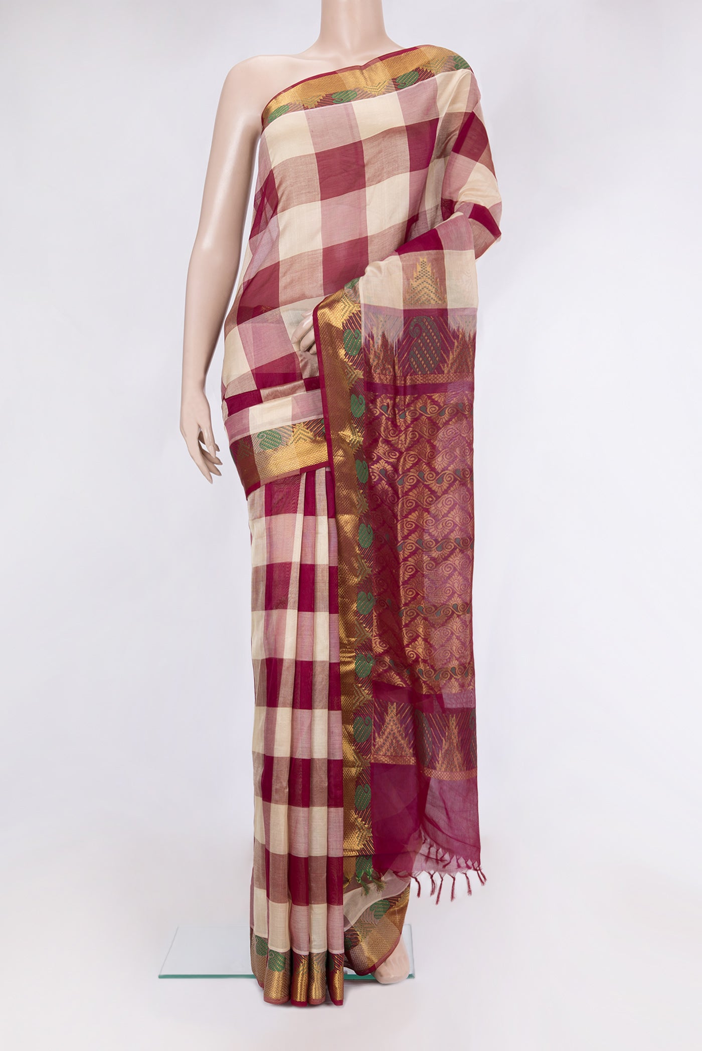 Multi Color Silk Cotton Saree with Checked design on the body and Zari And Thread Border.  displayed on a mannequin