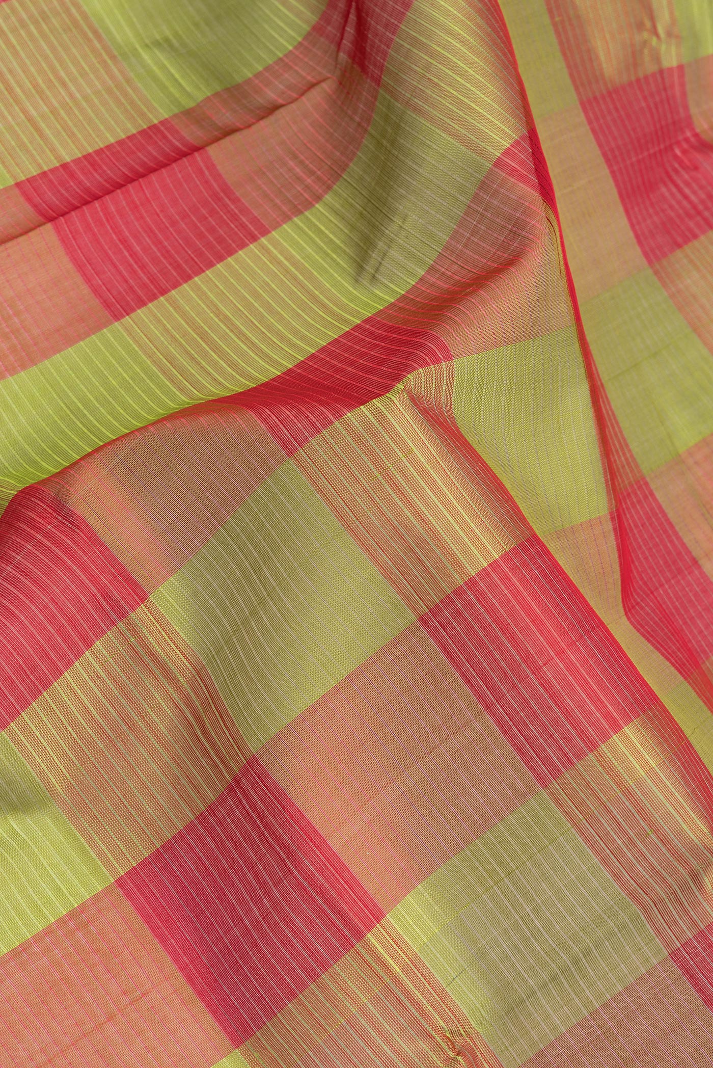 Close up of Multi Color Silk Cotton Saree with Checked design on the body and Zari Border.  displaying folds