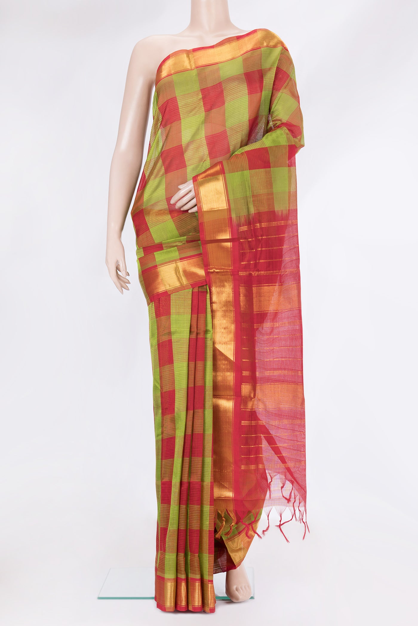 Multi Color Silk Cotton Saree with Checked design on the body and Zari Border.  displayed on a mannequin