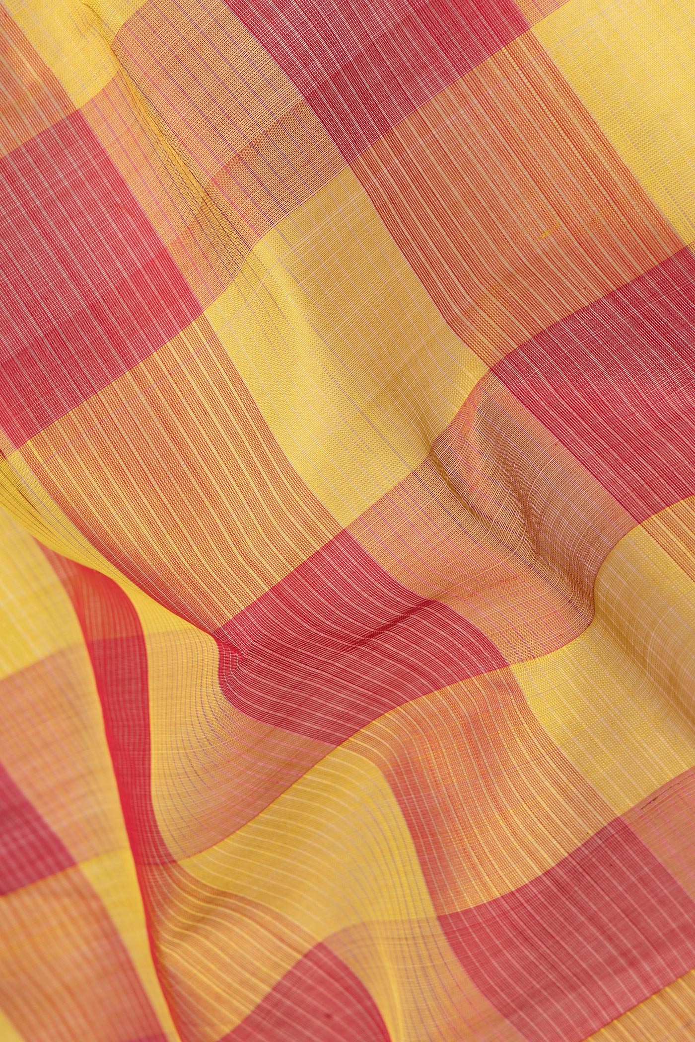 Close up of Multi Color Silk Cotton Saree with Checked design on the body and Zari Border.  displaying folds