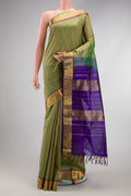 Pista Green Silk Cotton Saree with Checked design on the body and Zari Border.  displayed on a mannequin