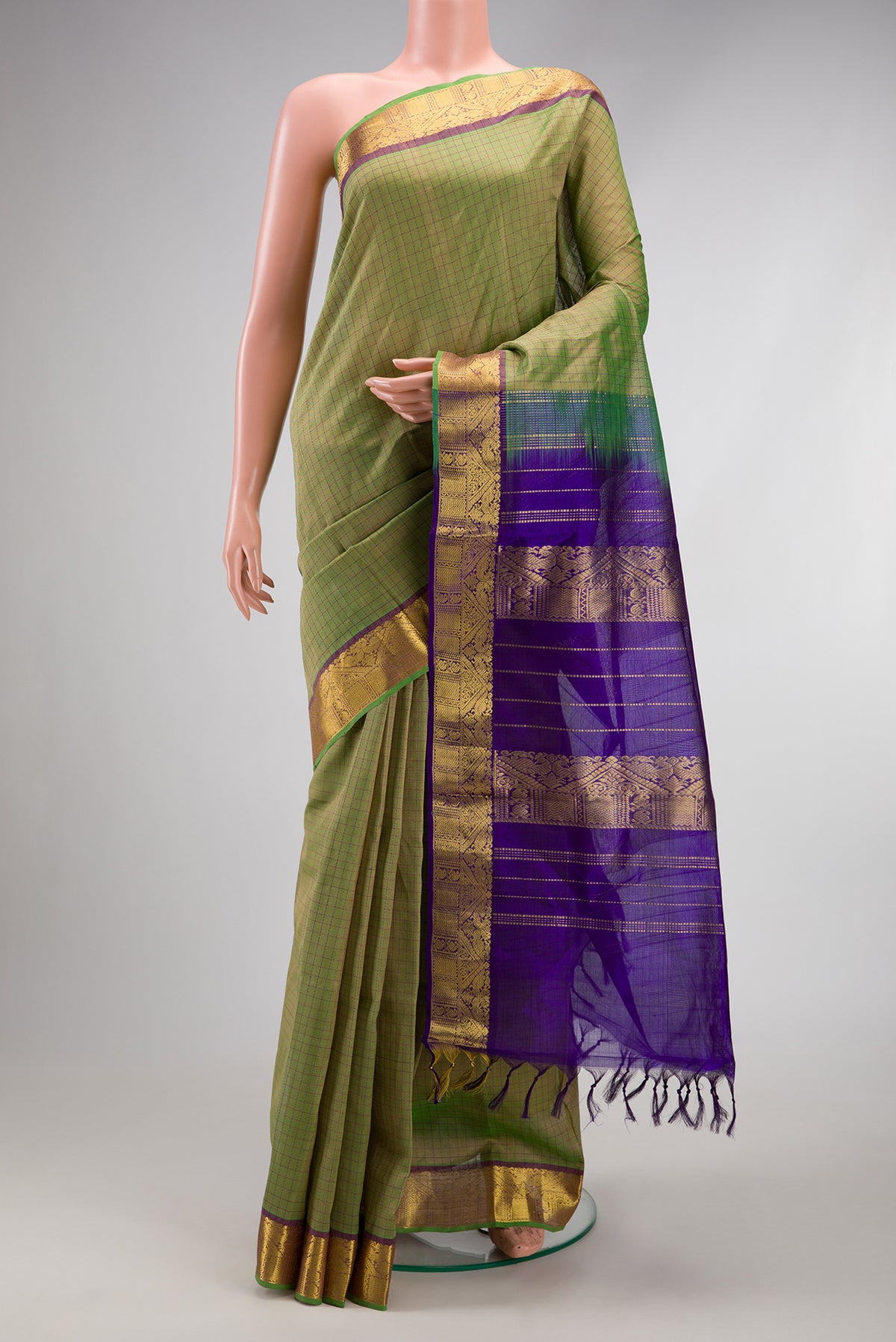 Pista Green Silk Cotton Saree with Checked design on the body and Zari Border.  displayed on a mannequin