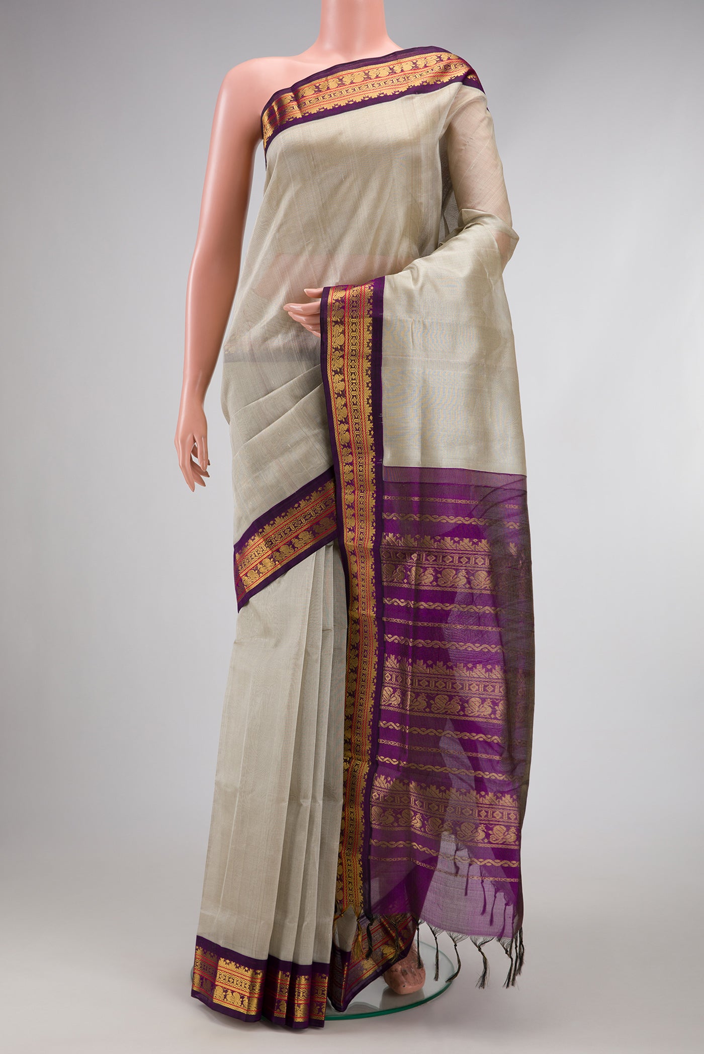 Grey Silk Cotton Saree with Plain Body and Zari Border.  displayed on a mannequin