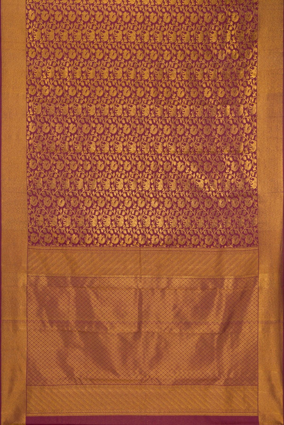 Flat view of Maroon Kanchipuram Silk Saree with Zari Brocade on the body and Zari Border. 