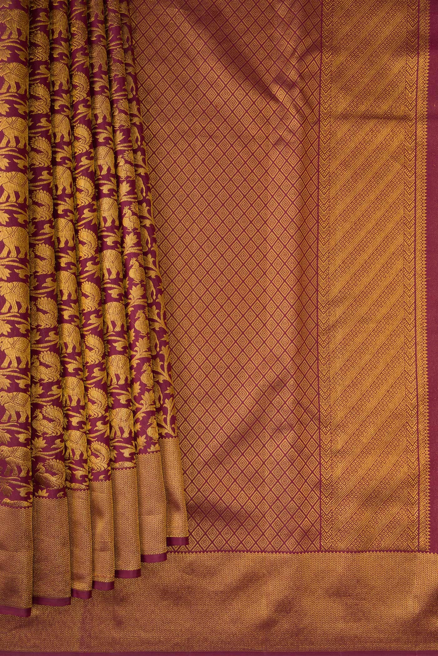 Pleats and pallu of Maroon Kanchipuram Silk Saree with Zari Brocade on the body and Zari Border. 