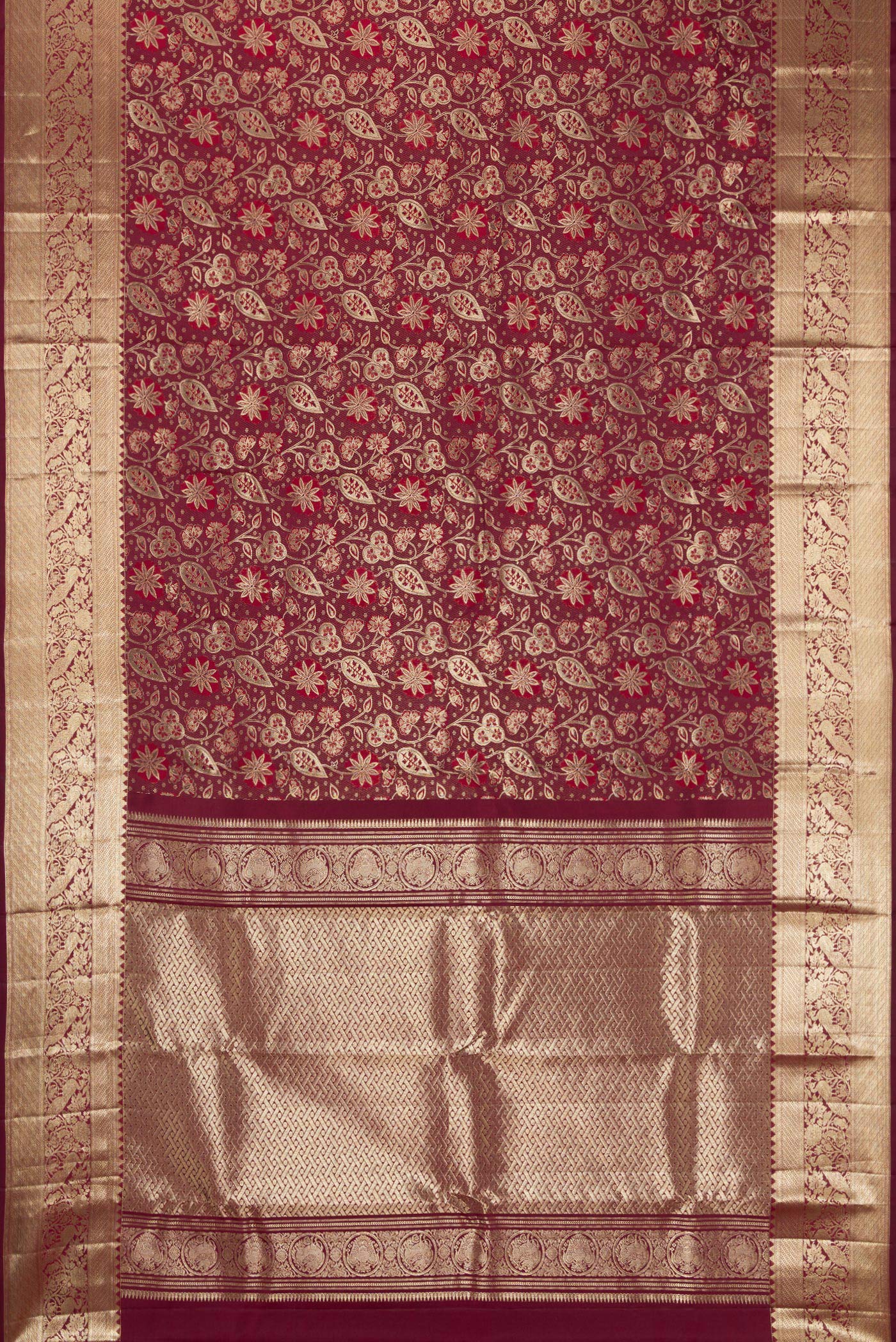 Flat view of Maroon Kanchipuram Silk Saree with Zari Brocade on the body and Fancy Border. 