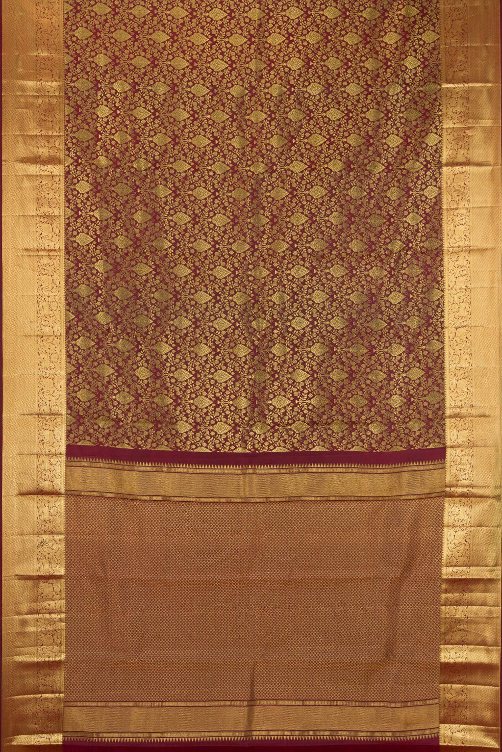 Flat view of Maroon Kanchipuram Silk Saree with Zari Brocade on the body and Zari Border. 
