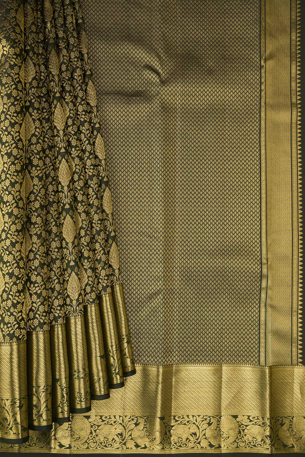 Pleats and pallu of Bottle Green Kanchipuram Silk Saree with Zari Brocade on the body and Zari Border. 