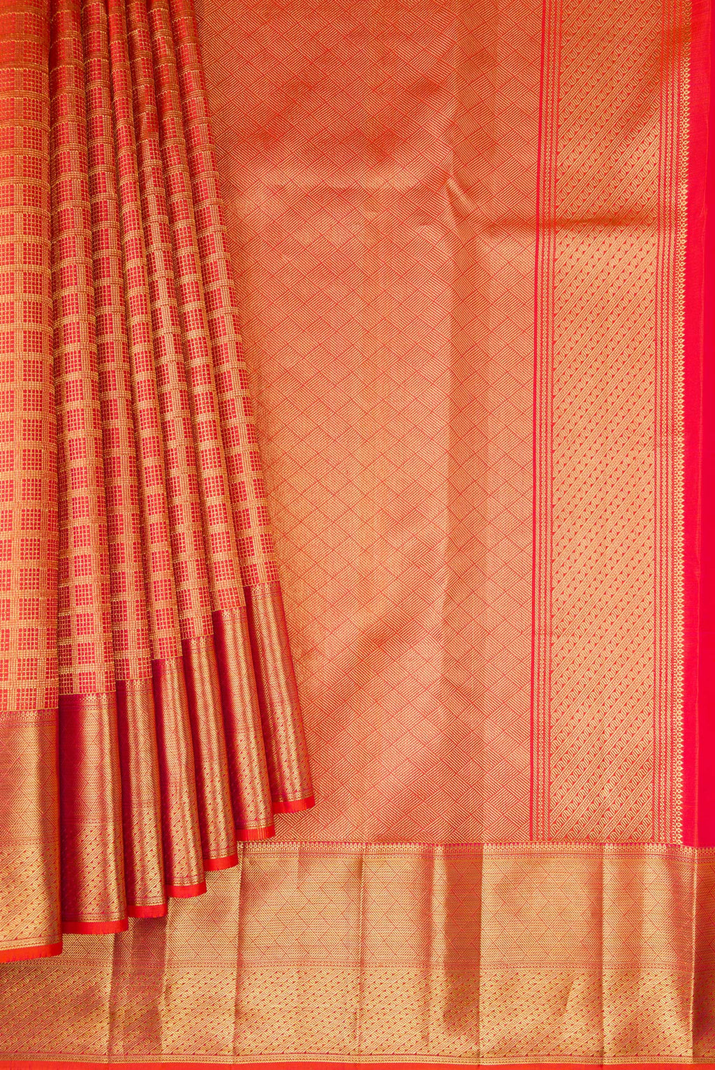 Pleats and pallu of Orange Kanchipuram Silk Saree with Zari Brocade on the body and Zari Border. 