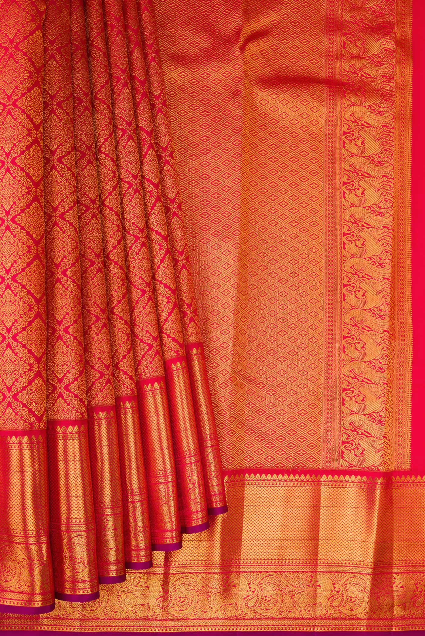 Pleats and pallu of Red Kanchipuram Silk Saree with Zari Brocade on the body and Zari Border. 
