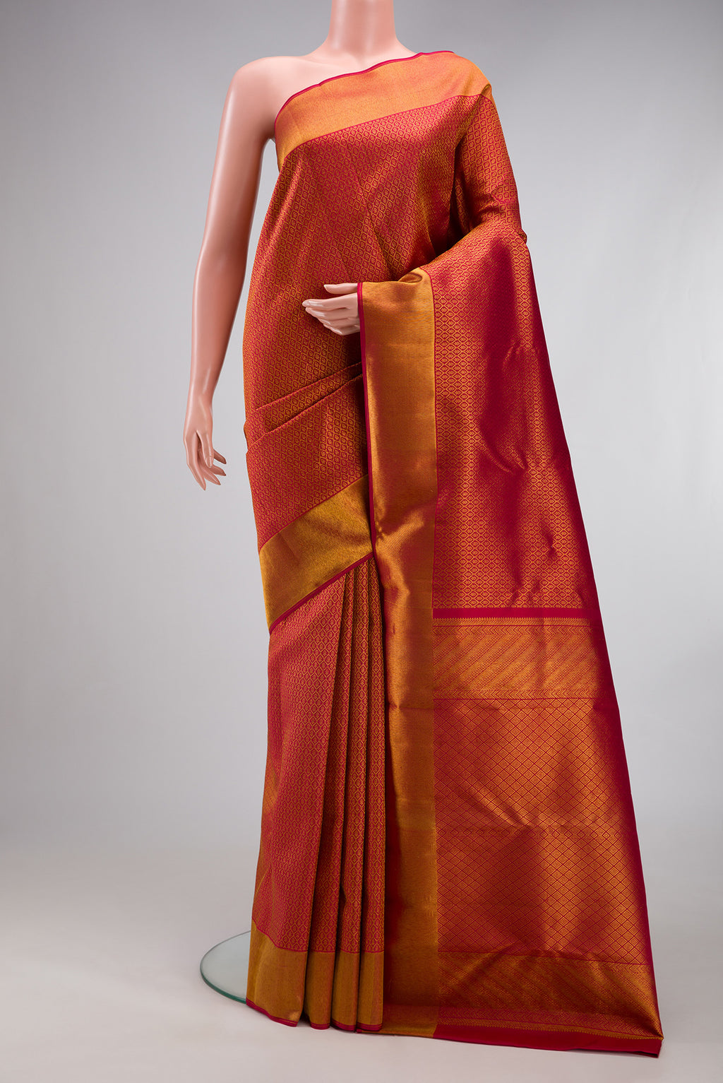Maroon Kanchipuram Silk Saree with Zari Brocade on the body and Zari Border.  displayed on a mannequin
