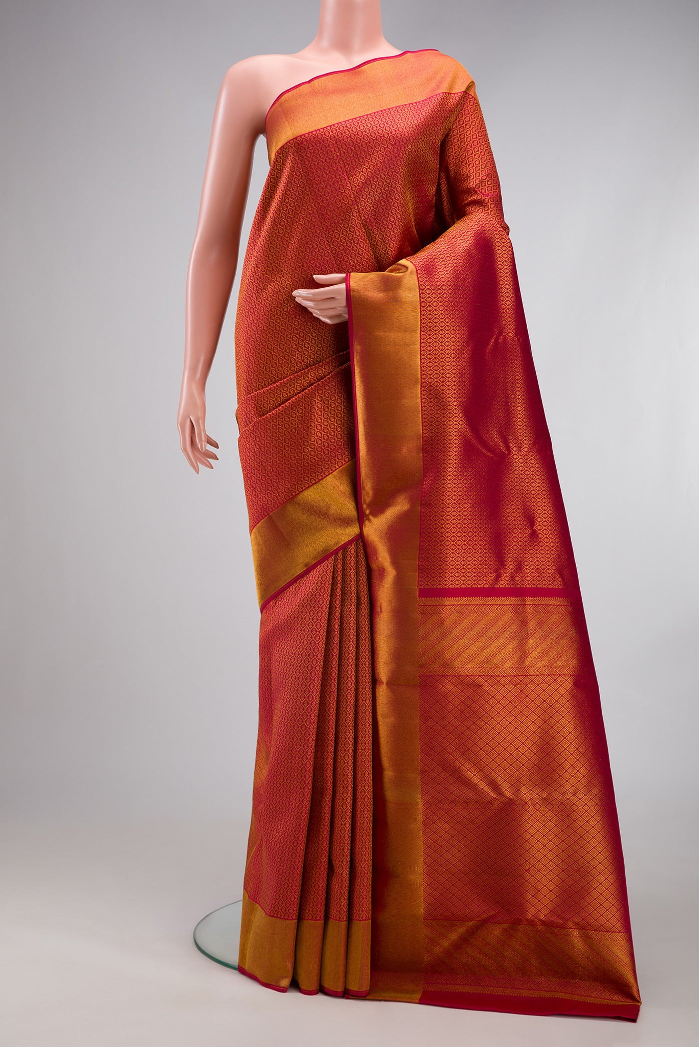 Maroon Kanchipuram Silk Saree with Zari Brocade on the body and Zari Border.  displayed on a mannequin