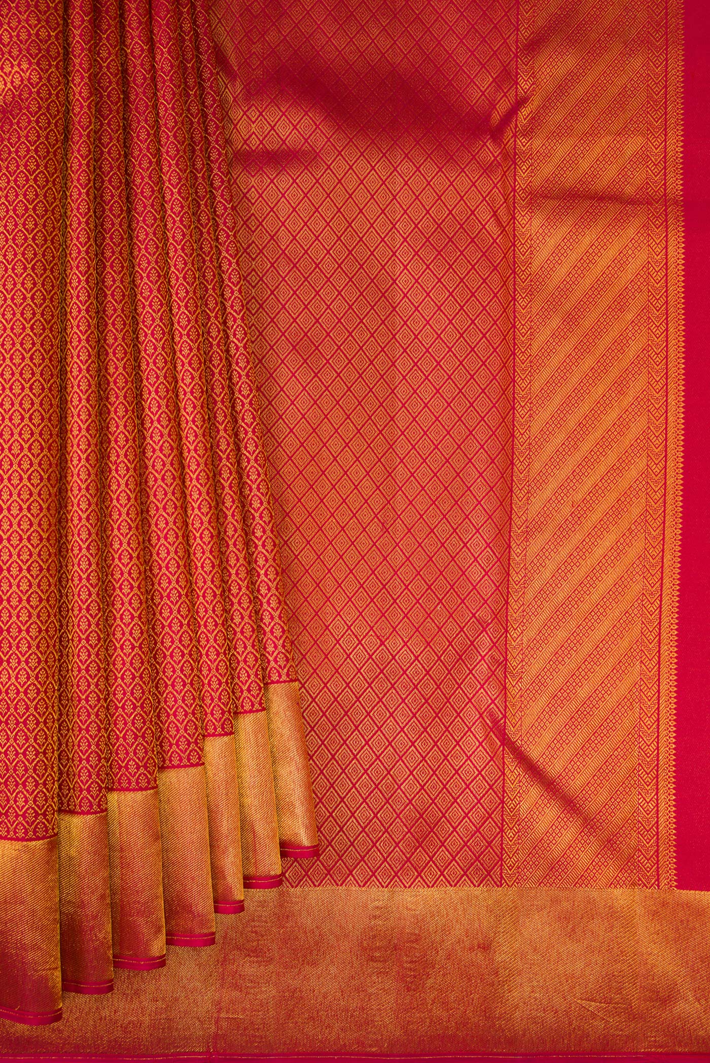 Pleats and pallu of Maroon Kanchipuram Silk Saree with Zari Brocade on the body and Zari Border. 