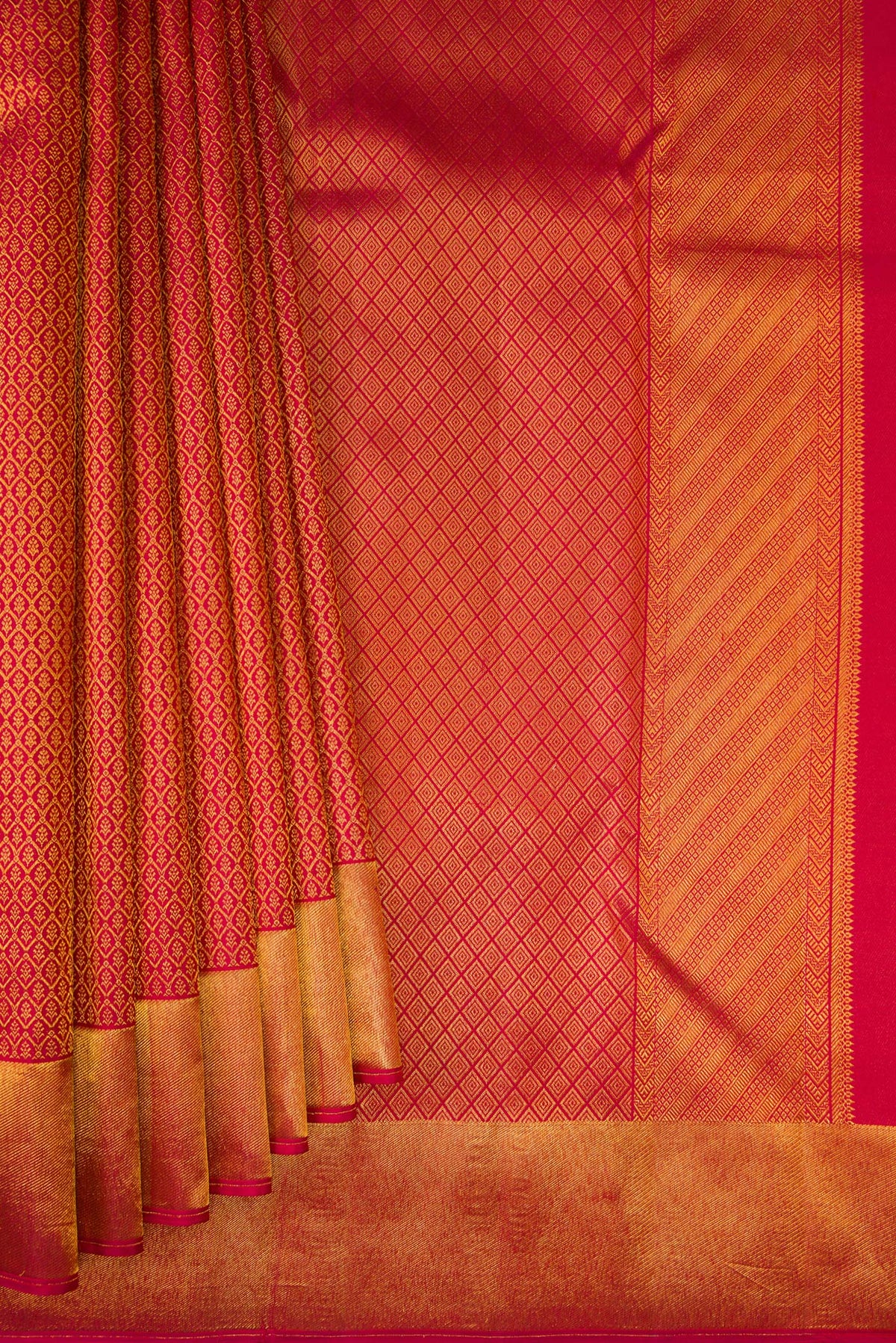 Pleats and pallu of Maroon Kanchipuram Silk Saree with Zari Brocade on the body and Zari Border. 