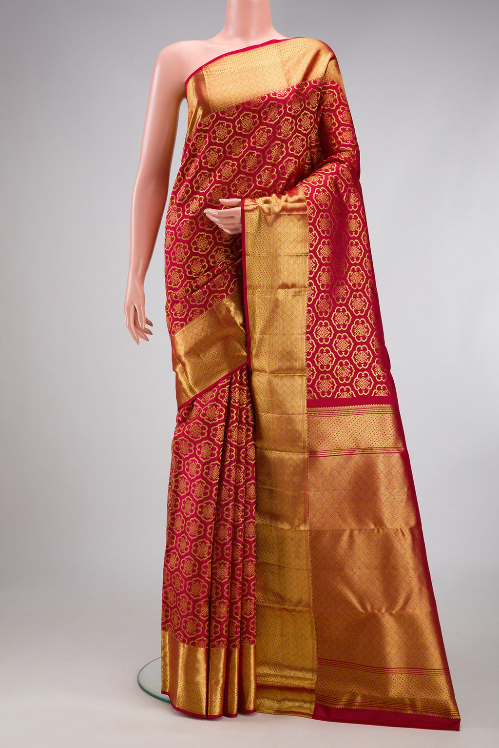 Maroon Kanchipuram Silk Saree with Zari Brocade on the body and Zari Border.  displayed on a mannequin