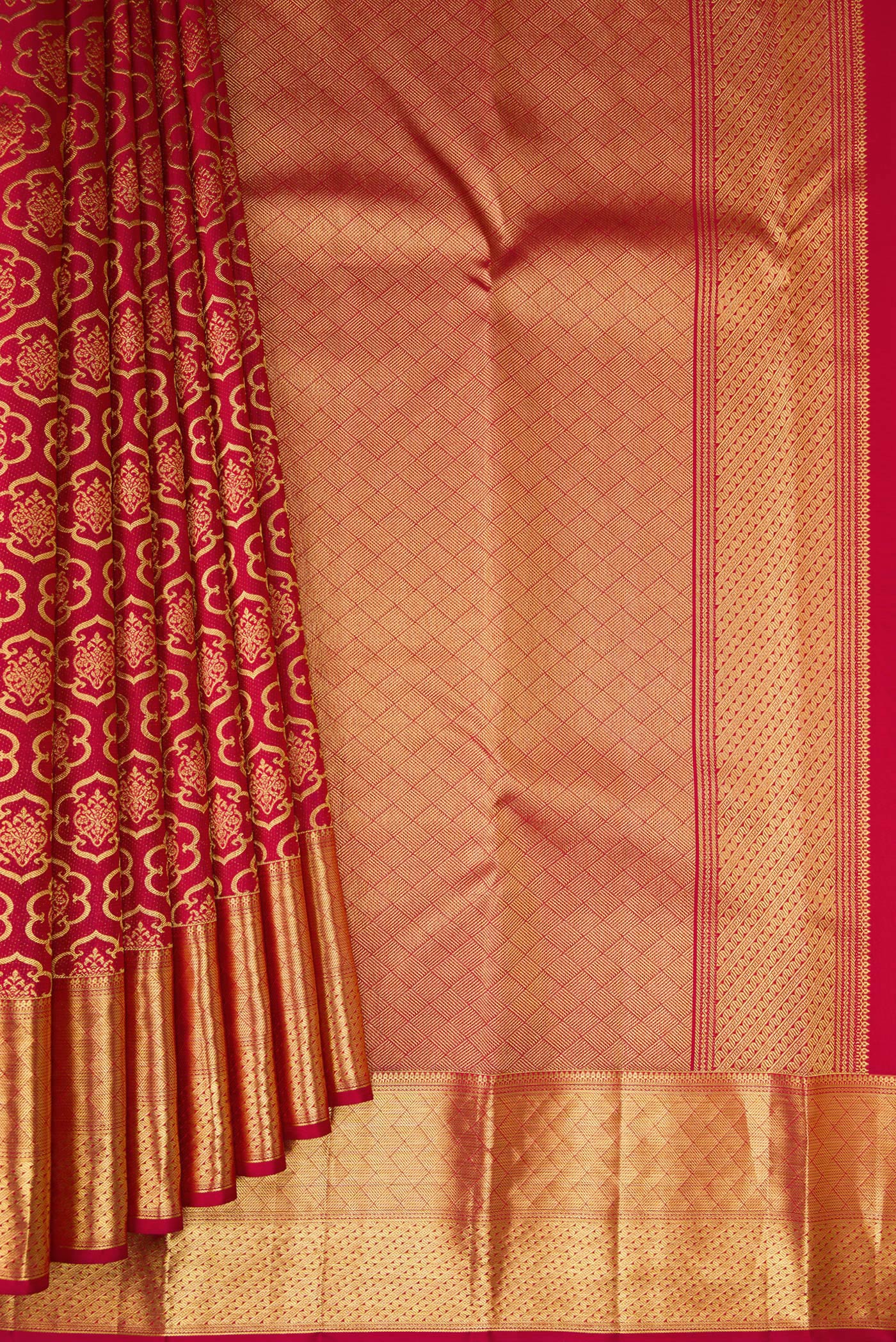 Pleats and pallu of Maroon Kanchipuram Silk Saree with Zari Brocade on the body and Zari Border. 