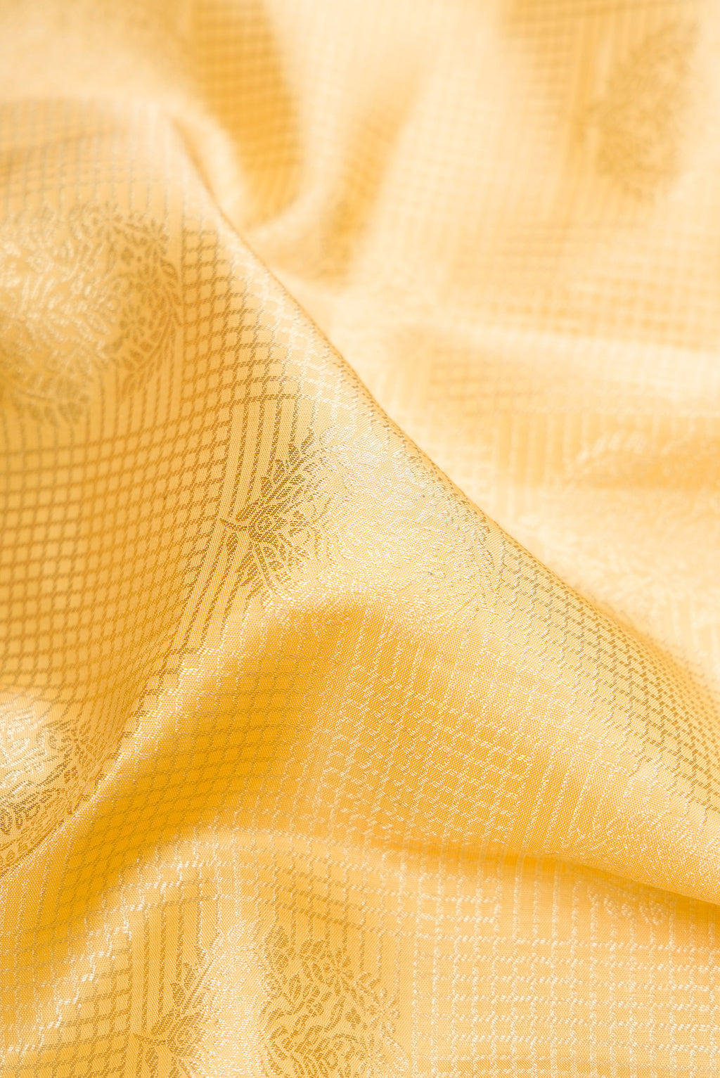 Close up of Sandal Kanchipuram Silk Saree with Zari Brocade on the body and Zari Border.  displaying folds