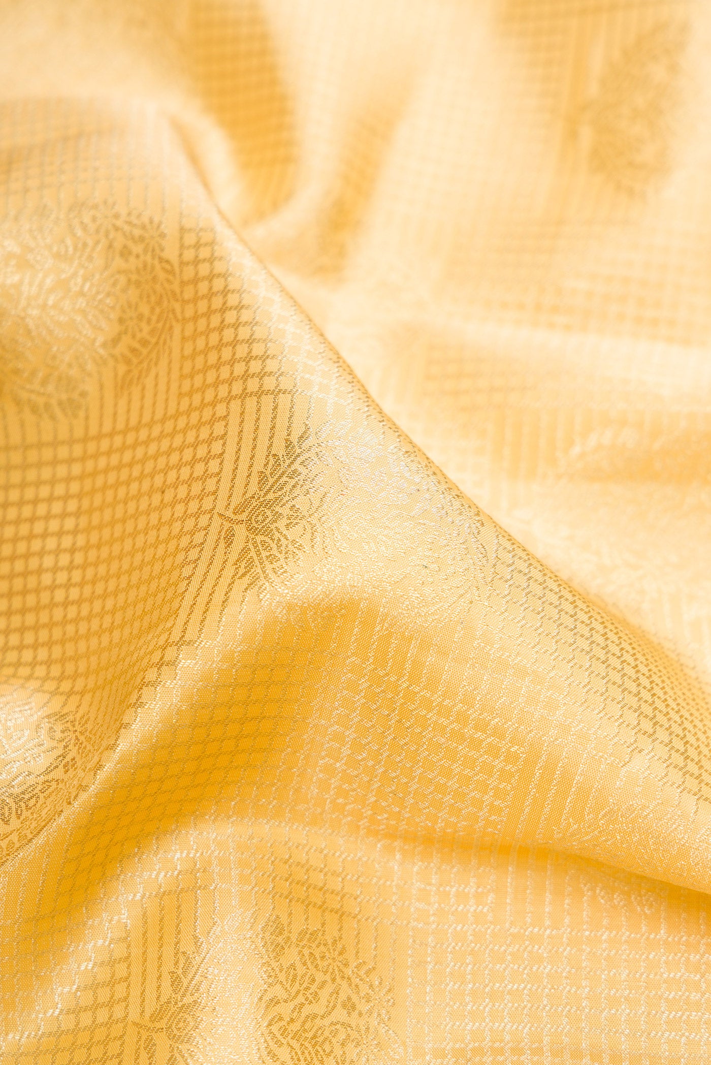 Close up of Sandal Kanchipuram Silk Saree with Zari Brocade on the body and Zari Border.  displaying folds