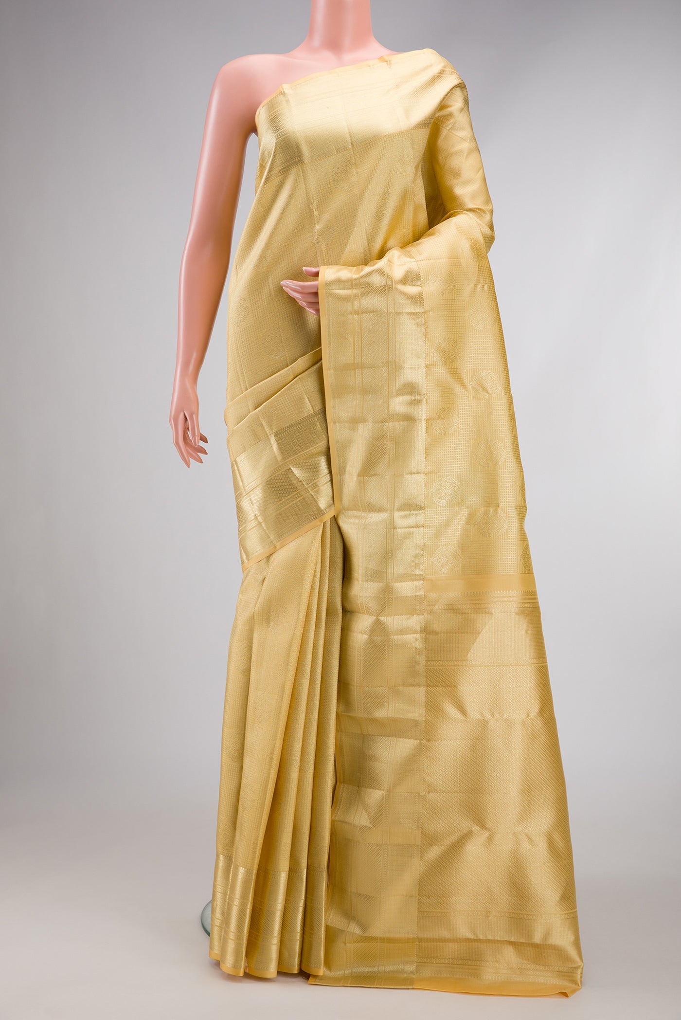 Sandal Kanchipuram Silk Saree with Zari Brocade on the body and Zari Border.  displayed on a mannequin