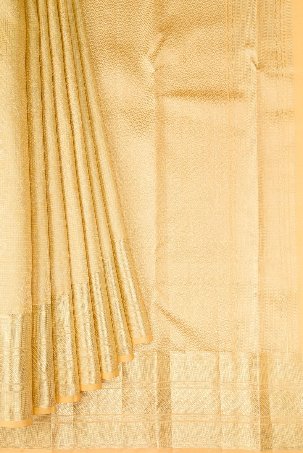 Pleats and pallu of Sandal Kanchipuram Silk Saree with Zari Brocade on the body and Zari Border. 