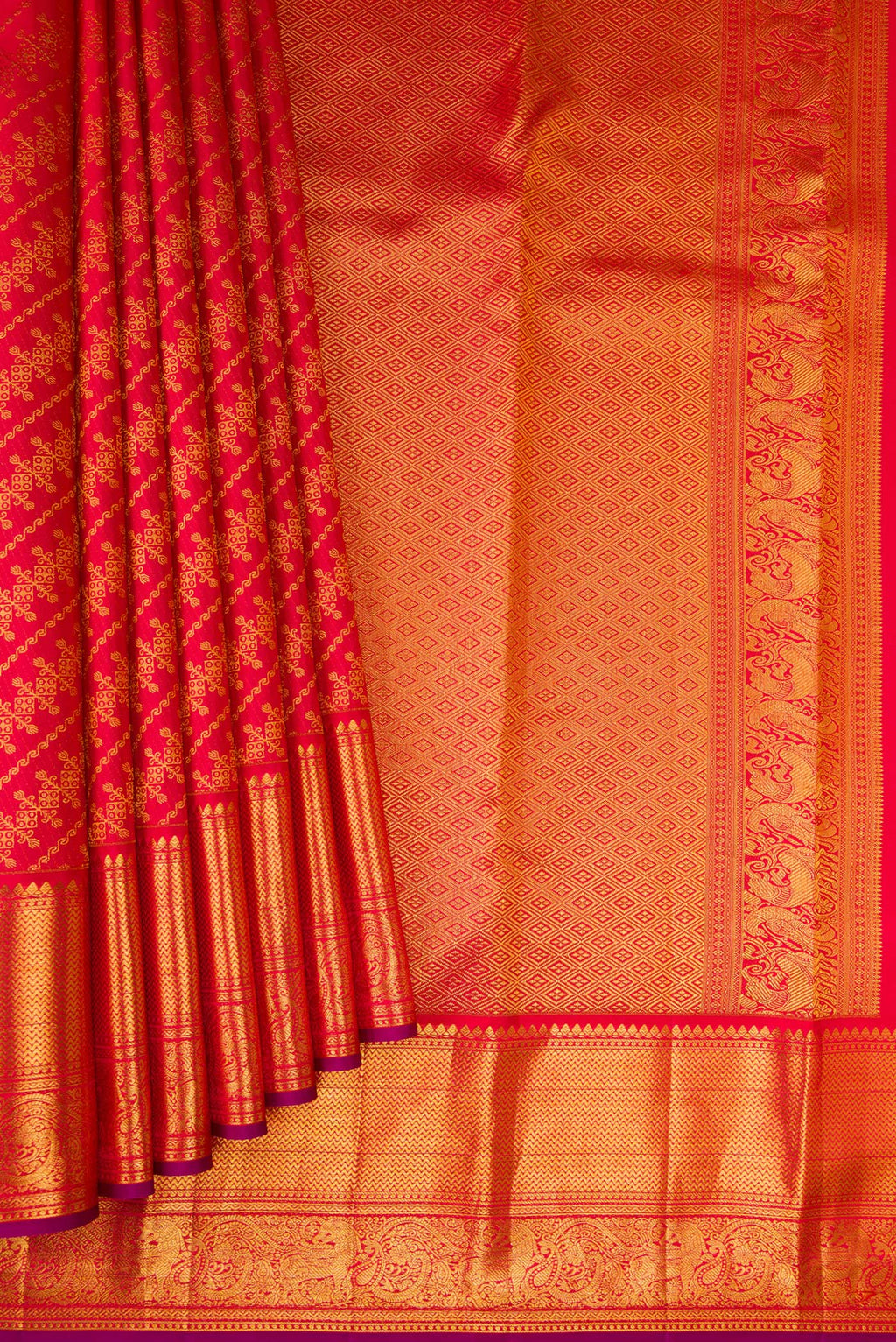 Pleats and pallu of Red Kanchipuram Silk Saree with Zari Brocade on the body and Zari Border. 