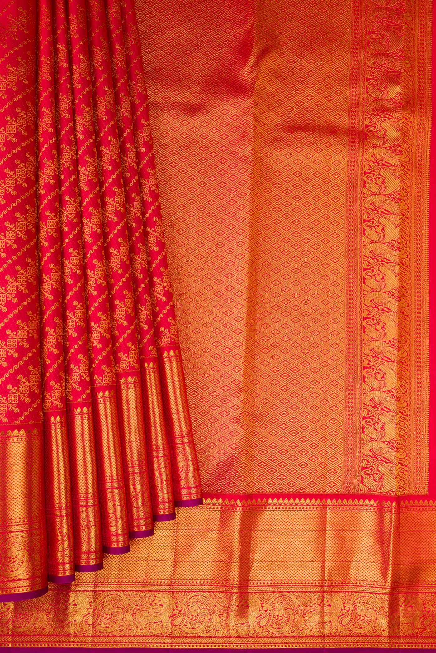 Pleats and pallu of Red Kanchipuram Silk Saree with Zari Brocade on the body and Zari Border. 